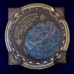 an astronomical map with stars and the names of all planets in gold on a blue background