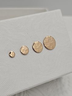 ✯ Simple & classy dainty hammered stud earrings ✯ Handmade by me using US sourced 14 karat yellow gold filled sheet   ✯ Free shipping ✯ Item shipped in gift box ✯ Offered in many sizes to fit any occasion Size XS - 3mm/ Size S - 5mm/ Size M - 6mm/ Size L - 8mm This listing is for a pair of dainty yellow gold filled hammered disc earrings with yellow gold filled butterfly backings.  If you are looking for the minimalist look than these are for you. They look great by themselves or paired with mul Tiny Studs, Disc Earrings, Small Earrings Studs, Geometric Earrings, Earrings Handmade, Jewelry Earrings Studs, Gold Filled, Piercings, Dots