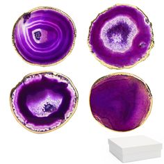 three pieces of purple agate glass with gold rims on each side and one piece in the middle