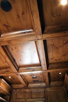 wood paneled ceiling with light coming from the top