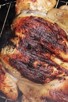 a close up of a chicken on a grill