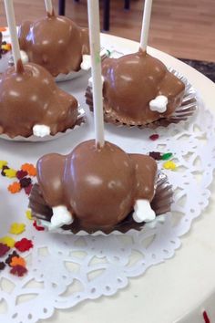 chocolate covered marshmallows on a white plate