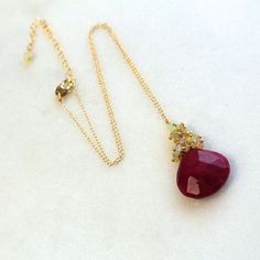 "The 20mm ruby pendant is table faceted, full of glow and rich color and has intense polish and sparkle. It hangs beneath a cluster of reflective rainbow Ethiopian opals. The length is a very flattering 17\" - 19\" long - adjustments can be made, please inquire. An absolute one and only piece, don't miss out. Pair this with any of my ruby earrings!" Ruby Briolette Gemstone Jewelry, Black Diamond Pendant, Ethiopian Opal Necklace, Ruby Necklace Pendant, Ruby Pendant, Ruby Earrings, Diamond Pendant Necklace, Quartz Necklace, Opal Necklace