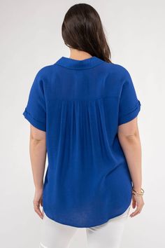 Hey Friends! Love the bright royal blue of this top! Short rolled sleeves and a button down collar works for casual days or the office! POINTED COLLAR FRONT FUNCTIONAL BUTTONS FOLDED CUFF SHORT SLEEVES 80% RAYON 20% NYLON Blue Shirt With Roll-up Sleeves And Shirttail Hem, Blue Collared Top With Roll-up Sleeves, Blue Blouse With Button Cuffs And Shirttail Hem, Blue Collared Top With Cuffed Sleeves, Blue Collared Blouse For Work, Blue Relaxed Fit Blouse With Cuffed Sleeves, Blue Tops With Button Cuffs For Day Out, Blue Blouse With Cuffed Sleeves Relaxed Fit, Blue Blouse With Relaxed Fit And Cuffed Sleeves