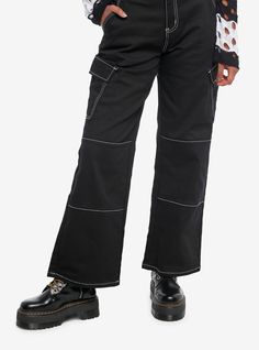 These cargo pants will become your new favorite pair of pants! They are black with white contrast stitching  with large cargo pockets and a removable buckle belt. They have a wide leg.97% cotton; 3% spandexWash cold; dry lowRise: 12"Inseam: 32"Leg opening: 11"ImportedListed in junior sizesModel is 5'9"Model wears size Small Cheap Edgy Cargo Pants With Pockets, Cheap Edgy Cargo Pants, Cheap Black Cargo Jeans With Belt Loops, Trendy Straight Leg Cargo Pants With Contrast Stitching, Black Cargos And White Shoes, Contrast Stitching Cotton Cargo Jeans For Work, Trendy Wide Leg Cargo Pants With Contrast Stitching, Trendy Black Pants With Contrast Stitching, Trendy Cotton Cargo Pants With Contrast Stitching