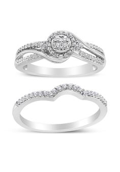 two white gold wedding rings with diamonds on each band and one diamond set in the middle