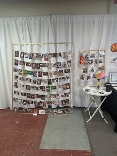 a room filled with photos and pictures on the wall next to a white drapes