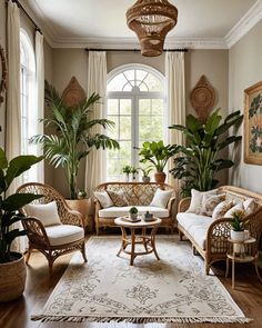 a living room filled with lots of furniture and plants