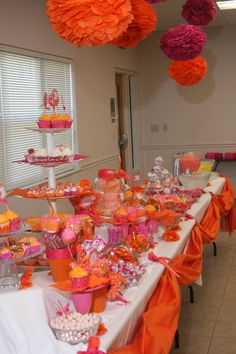 the table is set up with many different desserts