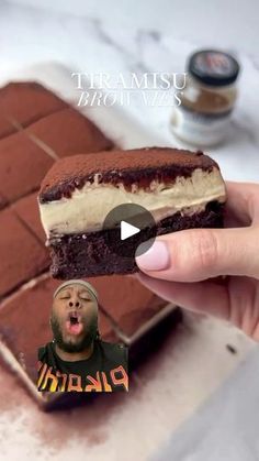 a person holding up a chocolate ice cream sandwich in front of a photo with the caption