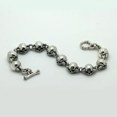 SKU: i3698 Beautiful bracellet with skull and bones parts. Features: Brand new sterling pendant silver 925. Not plated, 100% solid silver metal! The average weight of the product - 57.0 g. (22.5cm Lenght); Processing - Blacked oxidation; Availability of proprietary tag manufacturer - Yes; Country of origin - Ukraine; FAQs about Bracelet Fit - https://www.overstock.com/guides/faqs-about-bracelet-fit More products on www.indigo.jewelry Online Cataloque www.indigo.shop Sterling Silver Skull Jewelry Hallmarked, Sterling Silver Skull Jewelry With Polished Finish, Classic Sterling Silver Skull Jewelry, Classic Engraved Skull Jewelry, Indigo Jewelry, Average Weight, Unisex Bracelets, Mens Silver Rings, Unisex Ring