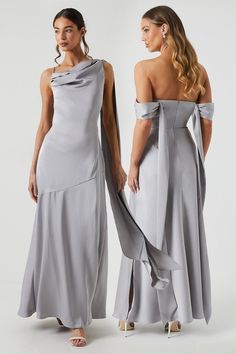 two women in grey dresses standing next to each other