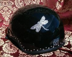 a black helmet with silver sequins on it