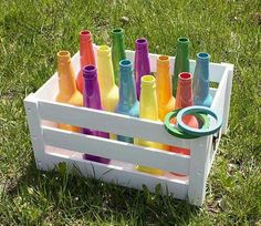 a box filled with lots of different colored bottles next to the words, bottle ring toss game take the fun and games outside this summer