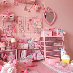 a room filled with lots of pink toys and decor on the walls, including teddy bears