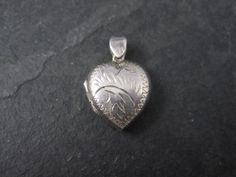 This beautiful heart locket is sterling silver. Marks: 925 Condition: Excellent with minor patina Silver Heart Locket Necklace Collectible, Heart Shaped Hallmarked Silver Locket Necklace, Vintage Heart-shaped Sterling Silver Locket Necklace, Silver Heart Locket Necklace With Charms, Antique Heart-shaped Jewelry Stamped 925, Antique Heart-shaped 925 Stamped Jewelry, Puffy Heart, Heart Locket, Beautiful Heart