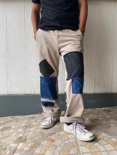 "Description: Uniqueness is here for those who love‼️ It's originally chino pants in plain khaki which 3 - 4 different tone colors of denim were patched on the front and back of the pants as photos shown. The work has completely done by both machine and hand sewing stitches in order to make it unique and perfect combination.  Photos describes the product better. So, just have a look-see at them all and read the special features below before you decide to purchase it.  Features: - Patchwork chino pants. -  3 - 4 different tone colors of denim were patched on the front and back of the pants - Frayed jeans were also used as detailing.  - Two side pockets and two rare pockets + one patched denim pocket. - Relaxed fit. - It's originally made in Maldives. Size: Waist: 34 - 35\" (Round) Hips:  40 Casual Patchwork Tapered Leg Bottoms, Casual Straight Leg Bottoms With Patches, Casual Denim Patchwork Pants, Indigo Cotton Bottoms For Streetwear, Casual Patchwork Denim Blue Bottoms, Casual Denim Blue Patchwork Bottoms, Casual Dark Wash Bottoms With Patchwork, Relaxed Fit Denim Bottoms With Patchwork, Relaxed Fit Denim Patchwork Bottoms