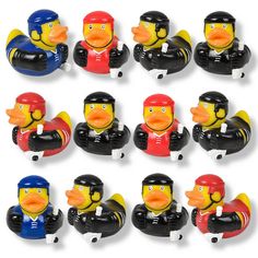 the rubber ducks are wearing helmets and holding their arms in each direction, while one is pointing