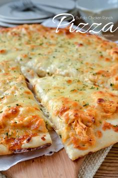 two slices of pizza sitting on top of a wooden cutting board