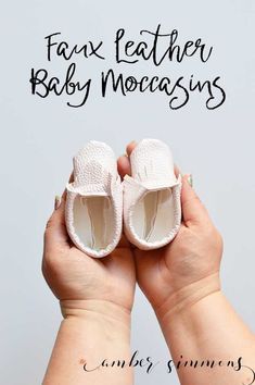 a person holding their baby shoes with the words fax leather baby moccains