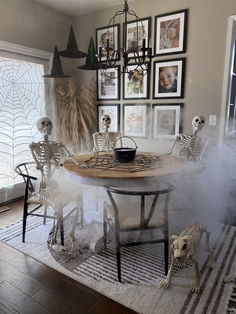 a dining room table with skeleton decorations on it