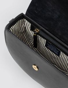 Inspired by our original Meghan bag from 2018, Ava is a modern and refined crossbody bag. The curved silhouette and firm structure make it the perfect saddle bag for street-style lovers with a luxurious touch. The half-moon shape is reminiscent of 90’s New York street style and is just as practical as is beautiful. Finished with an inside zipper pocket and magnetic closure flap, Ava makes a versatile choice for everyday wear. OMB-E163CV Ava Black, Classic Leather Bag, Crossbody Saddle Bag, Moon Silhouette, New York Street Style, Sustainable Leather, Antique Brass Hardware, Moon Shape, My Bag