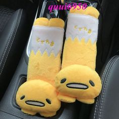 a pair of yellow slippers sitting on top of a car seat