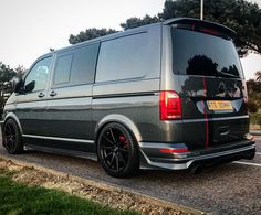 a grey van parked on the side of the road