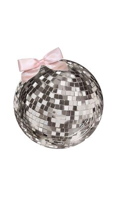 a silver disco ball with a pink bow on the front and back side, sitting on a white surface