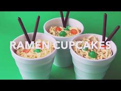 three plastic cups filled with ramen cupcakes on top of a green background