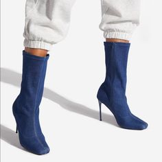 A Mid-Calf Bootie With A Stiletto Heel And Pull-On Construction. Material: Textile Features: Sd Dream Sole Double The Padding For Comfort, Support, And Ease Of Movement Outside Heel Height: 4" Shaft Height: 9" Casual Stretch Boots With Round Toe, Trendy Stretch Boots With Round Toe, Blue Fitted Pointed Toe Heeled Boots, Blue High Ankle Heels For Fall, Denim Blue Pointed Toe Winter Boots, Chic Blue High Ankle Heeled Boots, Winter Denim Blue Boots With Pointed Toe, Trendy Blue High Heeled Boots, Chic Denim Blue High Heel Boots