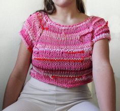 ~Free seed packet with each order!~ This funky crop top is a one-of-a-kind piece statement piece that is perfect for going to parties or wearing to brunch.  It is a light and breezy top for those warm summer nights. This top is hand knitted with zero waste scraps of yarn. - Fiber content: Acrylic, Cotton, Wool, Zero Waste Yarn/ Fiber - Size (inches): M, Shoulder to shoulder: 15; Top to bottom: 14; Bust: 17; Waist: 17 - Wash instructions: Hand wash with cold water only when necessary, lay flat to dry. Spot cleaning recommended when necessary to improve longevity of garment. Playful Cropped Tops For Spring, Fun Cotton Crop Top For Spring, Playful Crop Top For Summer, Playful Red Tops For Vacation, Playful Short Sleeve Crop Top For Summer, Fun Fitted Crop Top For Spring, Playful Fitted Crop Top For Spring, Fitted Playful Crop Top For Spring, Playful Summer Crop Tops