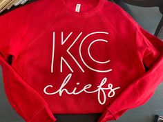 Red kingdom, baby! This sweatshirt is super soft and fleecey on the inside. For a more oversized fit we recommend sizing up one size. Diy Kc Chiefs Shirt, Chiefs Shirts For Women, Kansas City Chiefs Outfit Ideas, Diy Chiefs Shirts, Oversized Red Sweater With Letter Print, Red Crew Sweatshirt With Letter Print, Red Crew Neck Sweatshirt With Relaxed Fit, Red Relaxed Fit Crew Sweatshirt, Red Relaxed Fit Sweater With Letter Print