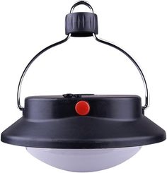 a black and white light with a red button on the front part of it's head