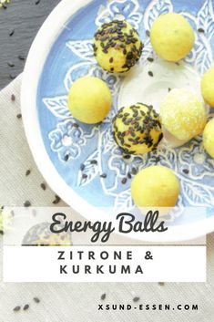 some food is on a blue and white plate with the words energy balls written below it