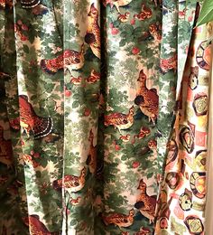 the curtains are decorated with colorful birds and flowers