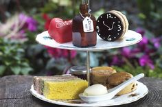 three tiered tray with different types of food on it