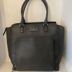 13x13x6 With A 6" Handle Drop. Charcoal Leather Calfskin Bag With Front Pocket And Interior Organization Pockets. Gold Hardware. Light Shaping On Outside Leather From Storage. Bottom In Excellent Condition. Interior Has Some Small Stains At Bottom Consistent With Regular Wear. Kate Spade Rectangular Bag With Zipper Pocket, Kate Spade Travel Bag With Zipper Pocket, Kate Spade Everyday Bag With Zipper Pocket, Gray Leather Bag For Work, Everyday Kate Spade Bag With Zipper Pocket, Elegant Kate Spade Bag With Zipper Pocket, Kate Spade Leather Bag With Zipper Pocket, Kate Spade Leather Bag, Leather Work Bag