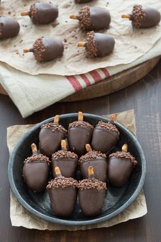 chocolate covered candies are in a bowl on a table