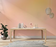 a living room with a table, lamp and books on the shelf next to it