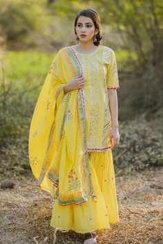 Shop for Kaia Yellow Cotton Mul Embroidered Kurta Sharara Set for Women Online at Aza Fashions Yellow Fitted Sharara With Chikankari Embroidery, Designer Yellow Sharara With Chikankari Embroidery, Yellow Chikankari Embroidery Sharara For Eid, Yellow Chikankari Sharara For Eid, Fitted Yellow Cotton Sharara, Yellow Chikankari Embroidery Palazzo Set For Festivals, Yellow Sharara With Straight Kurta, Yellow Cotton Sharara For Eid, Yellow Cotton Sharara With Gota Work