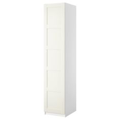 a tall white cabinet with three doors