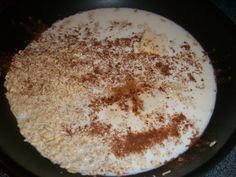 a pan filled with food sitting on top of a stove