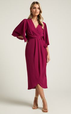 Elevate your cocktail game with the Meagan Midi Dress in Aubergine. This stunning wine-colored dress features a flattering V-neckline, flutter sleeves, and pleated details that create an elegant and feminine look. Made from high-quality polyester, this midi dress is comfortable to wear all night long. Perfect for any special occasion or night out on the town, this dress will make you feel confident and empowered wherever you go. Pair it with strappy heels and statement earrings for a head-turnin Fall Wedding Guest Dress, Wine Colored, Feminine Look, Flutter Sleeves, Wedding Guest Outfit, Strappy Heels, Purple Dress, Guest Dresses, Feel Confident