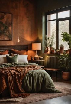 a large bed sitting next to a window with potted plants on top of it