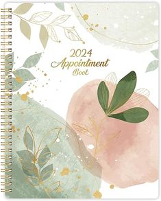 an appointment book with flowers and leaves on the cover, in pastel pink and green colors