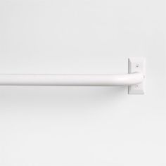 a white door handle on the side of a wall