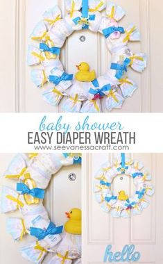 a baby shower wreath made out of diapers and rubber ducky toys is hanging on the front door