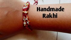 the handmade rakhi bracelet is on someone's arm