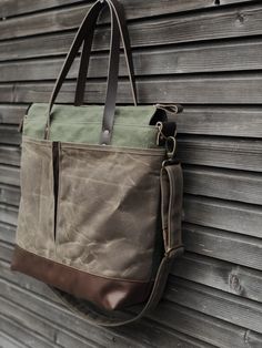 The material I used to make this bag is an American heavy weight waxed canvas. The color is olive for the body, outside pocket in oak brown on one side. The large outside pocket is made in olive waxed canvas on the other side I made it into an everyday bag, ideal to use as diaper bag or weekend bag, because of the many pockets with vegetable tanned leather handles and oiled leather bottom. Closing with a zipper. You can carry this bag in your hand, on your shoulder, or cross body with the adjust Outdoor Waxed Finish Tote Shoulder Bag, Waxed Canvas Tote Shoulder Bag With Waxed Finish, Green Waxed Canvas Tote Shoulder Bag, Khaki Canvas Shoulder Bag With Waxed Finish, Outdoor Waxed Canvas Tote Satchel, Outdoor Waxed Canvas Satchel Tote, Khaki Waxed Canvas Bag With Adjustable Strap, Outdoor Green Shoulder Bag With Waxed Finish, Green Canvas Shoulder Bag With Waxed Finish